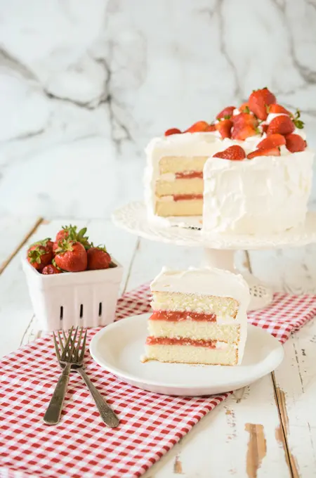 Vanilla-Buttermilk Layer Cake With Orange Frosting and Raspberries Recipe |  Epicurious