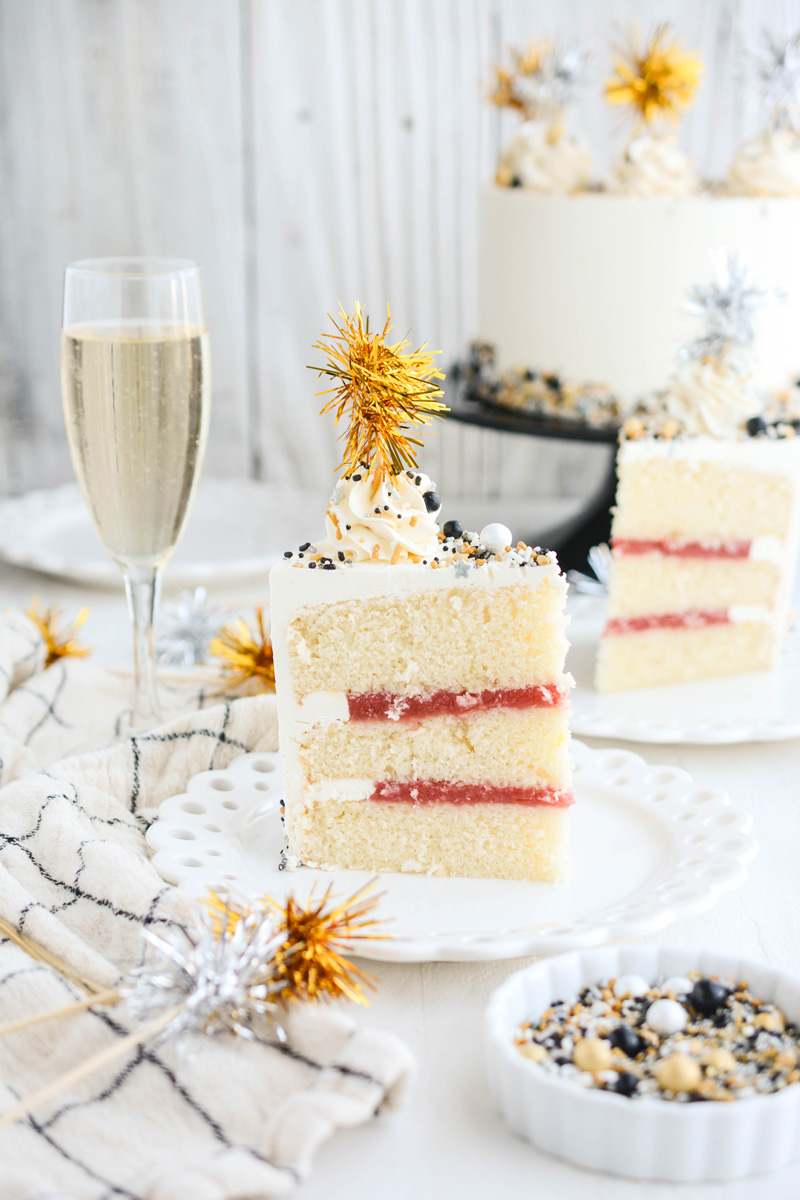 Slice of Champagne Cake with Strawberry Filling on cake plate.