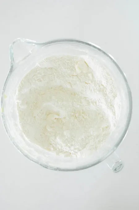 Bubble Gum Layer Cake overhead shot of butter incorporated in the dry ingredients.