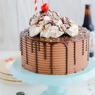 Chocolate Root Beer Float Cake white open shot on cake teal cake pedestal.