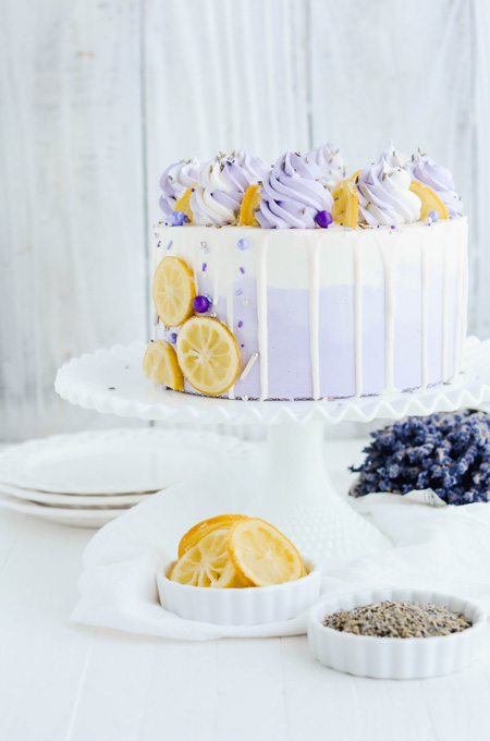 Lemon Lavender Layer Cake filled with lemon curd and frosted with lavender Swiss meringue buttercream.