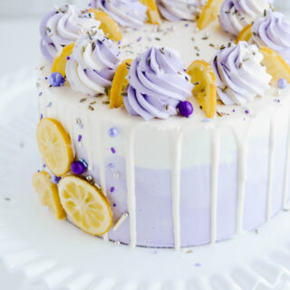 Lavender Lemon Layer Cake close up on cake pedestal.
