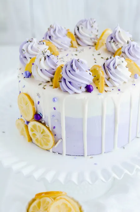 Lavender Lemon Layer Cake close up on cake pedestal.