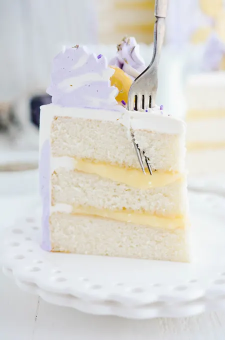 Lavender Lemon Layer Cake close up of cake slice with fork
