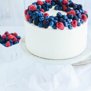 Mixed Berries and Cream Cake on pedestal.