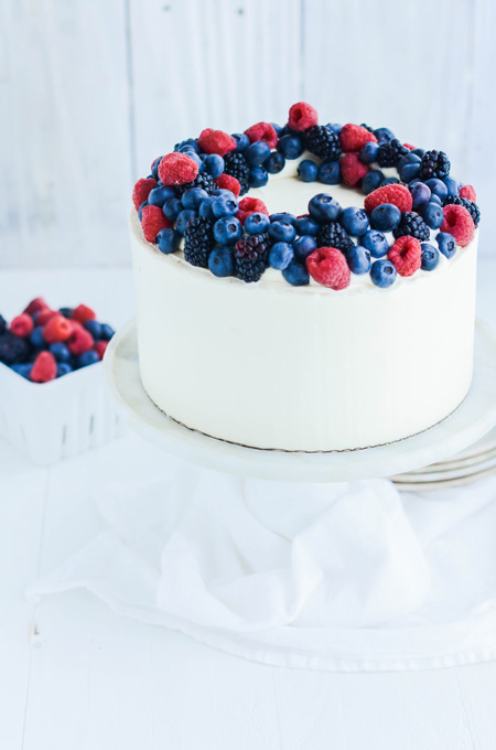 Mixed Berries and Cream Cake on pedestal.