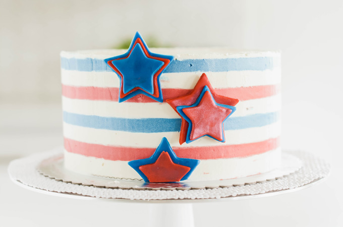 Stars and Stripes Vanilla Cake with stars applied to the side of the cake.