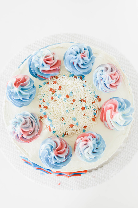Stars and Stripes Vanilla Cake overhead shot of how to apply sprinkles to the center of the cake completed.