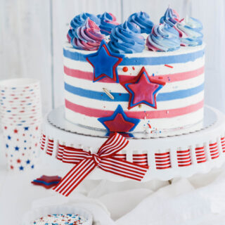 Stars and Stripes Vanilla Cake on cake pedestal.