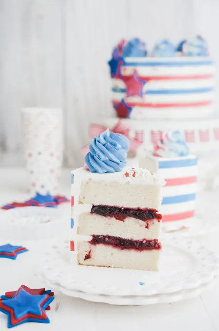 Stars and Stripes Vanilla Cake with cake slice.