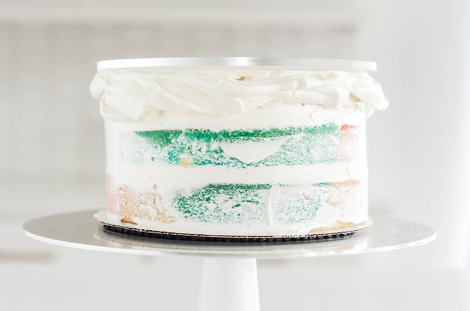 Cotton Candy Layer Cake cake top frosted with acrylic disc.