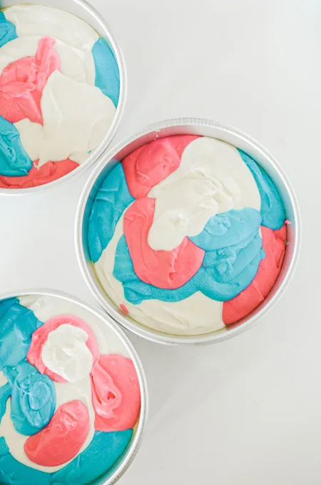 Cotton Candy Layer Cake overhead shot of colored batter in cake pans.