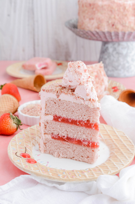 Strawberry Ice Cream Pop Cake shot of cake slice on a plate.