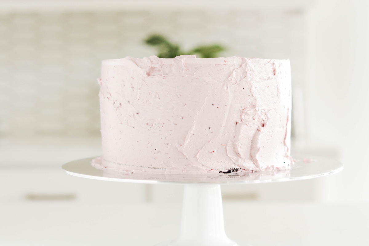Lime Cake with Blackberry Filling frosted cake.