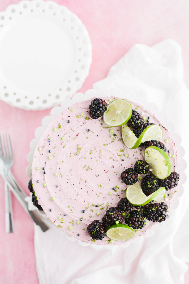 Lime Cake with Blackberry Filling overhead shot of whole cake on cake pedestal.