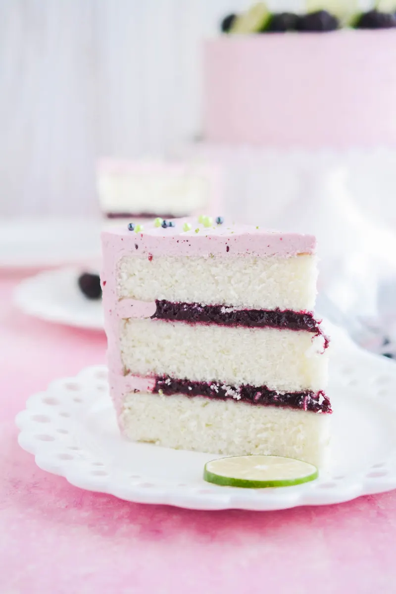Lime Cake with Blackberry Filling close up of cake slice.