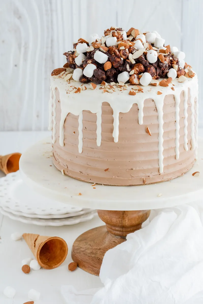 Rocky Road Layer Cake on cake pedestal close up.