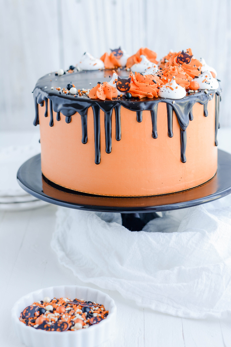 Devil’s Food Halloween Cake on black cake pedestal.