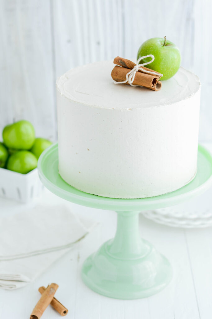Apple Spice Cake on green cake pedestal.