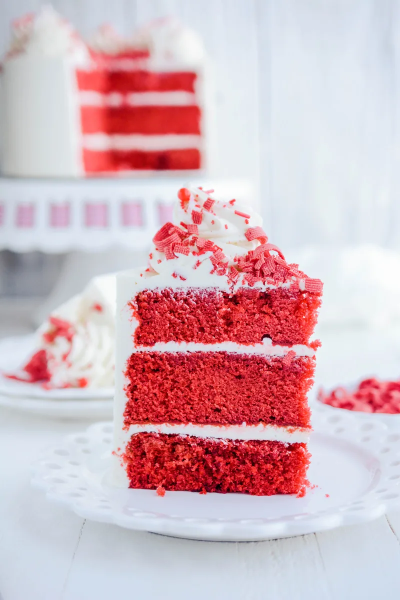 Fluffy Red Velvet Cake sliced on plate.