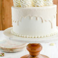 White Chocolate Pumpkin Cake on cake pedestal.