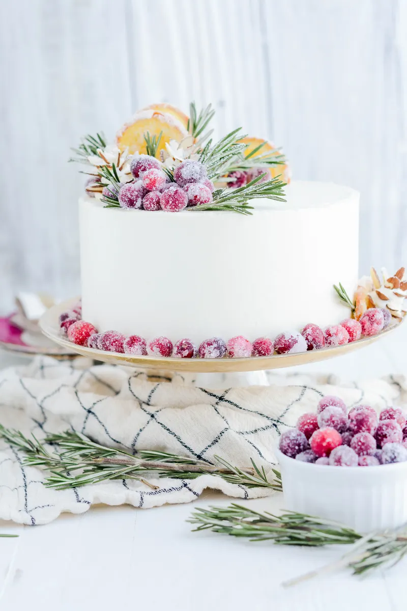 Orange Cranberry Cake on cake pedestal.