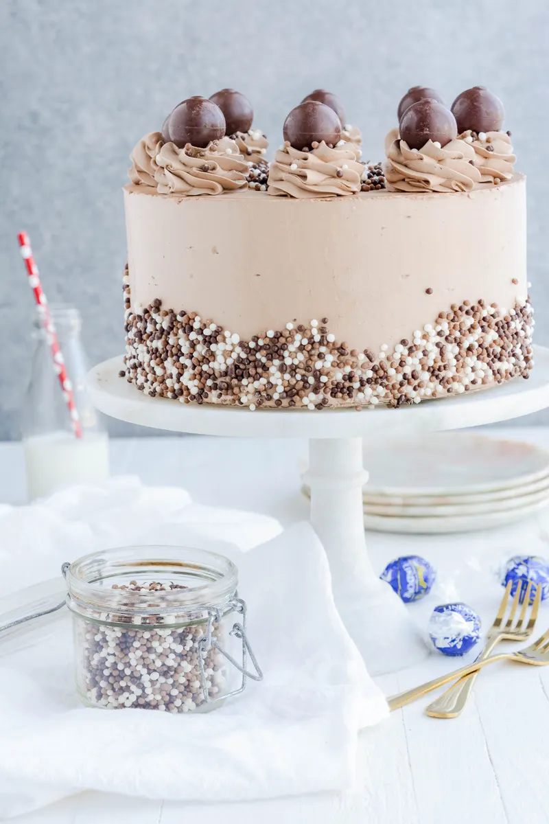 Super Moist Chocolate Cake on cake pedestal.