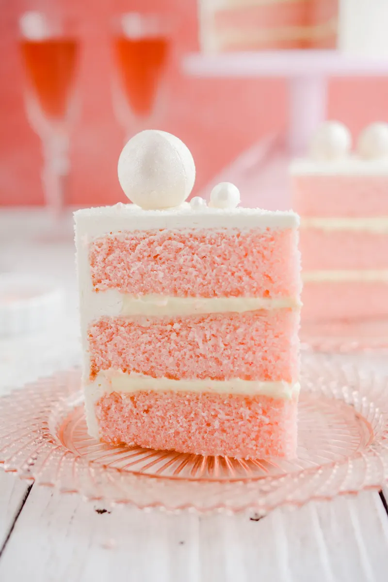 Close up of cake slice of Pink Champagne Layer Cake.