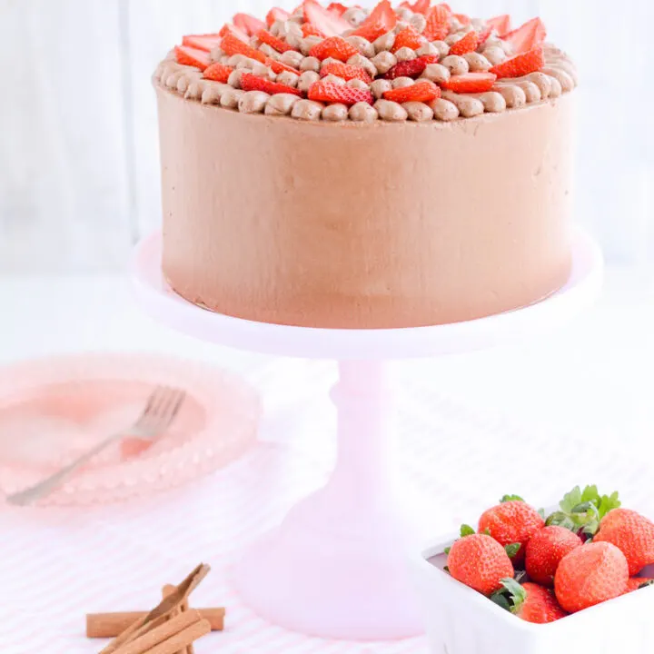 Strawberry Cinnamon Cake on pink cake pedestal.