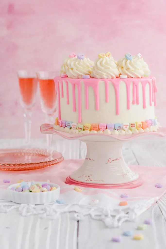 Valentine's Day Red Velvet Cake on a cake pedestal.