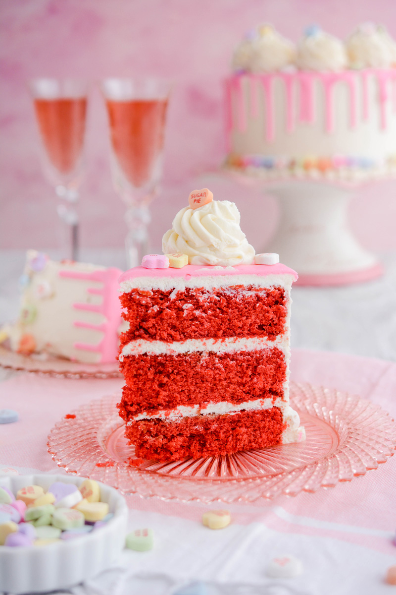Valentine's Day Red Velvet Cake sliced on a plate.