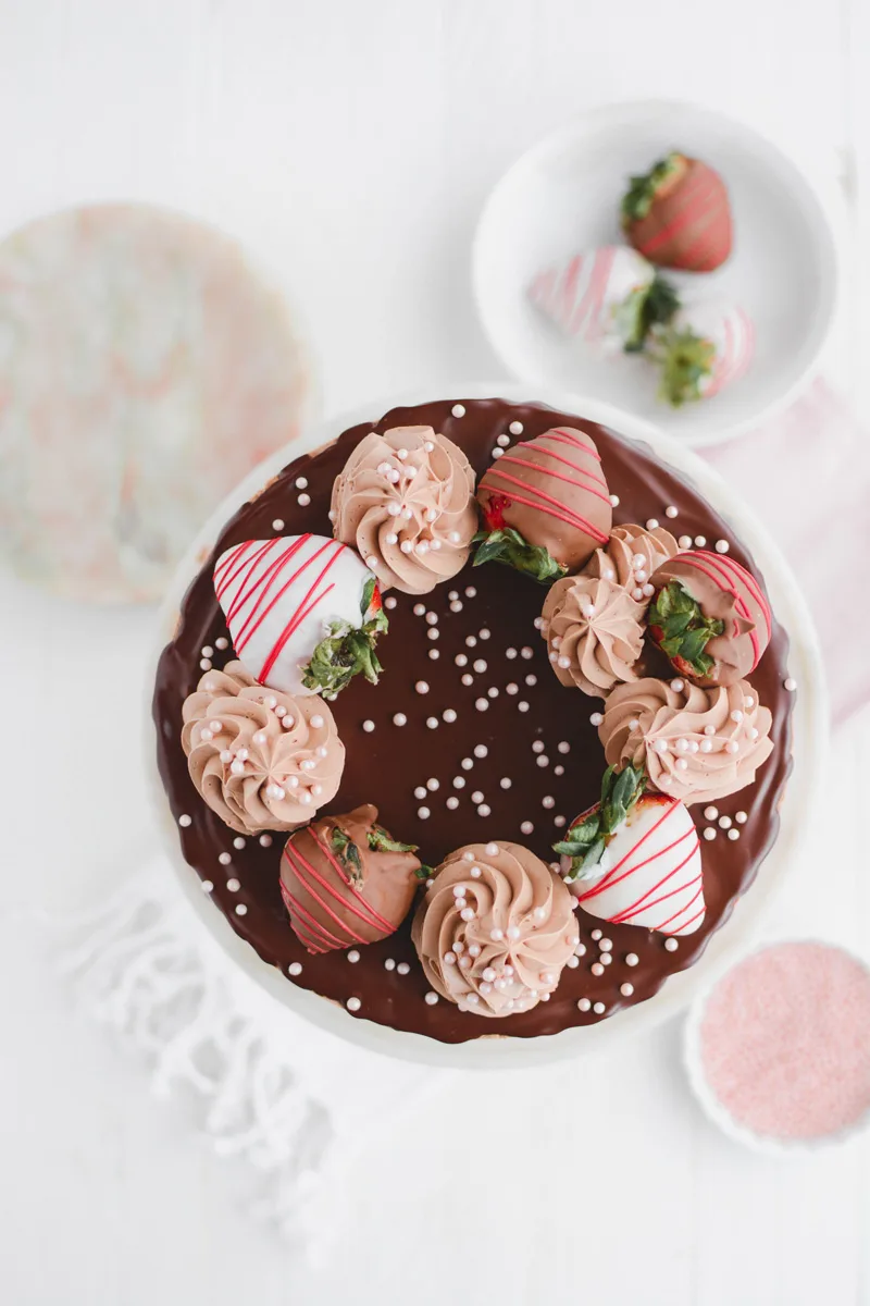 Overhead Chocolate Covered Strawberries Cake on cake pedestal.