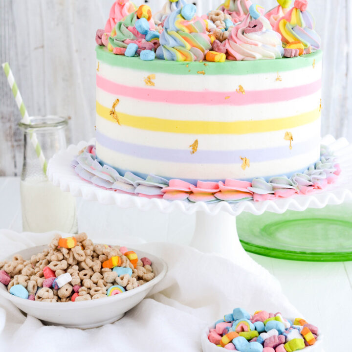 Lucky Charms Layer Cake on white cake pedestal.