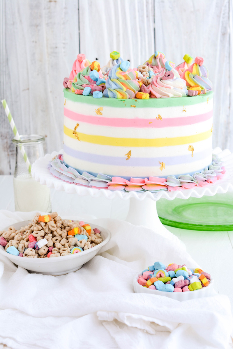 Lucky Charms Layer Cake on white cake pedestal.