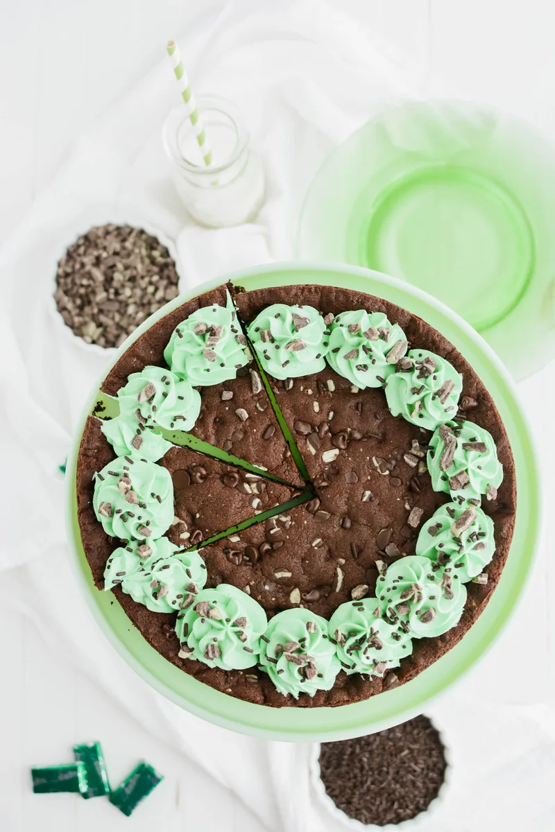 Overhead shot of Mint Chocolate Chip Cookie Cake sliced.