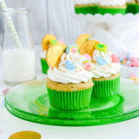 Couple of Marshmallow Lucky Charm Cupcakes on green plate.
