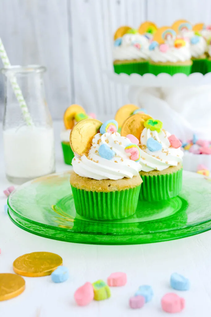 Couple of Marshmallow Lucky Charm Cupcakes on green plate.