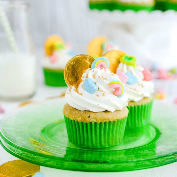 Close up of Marshmallow Lucky Charm Cupcakes on green plate.
