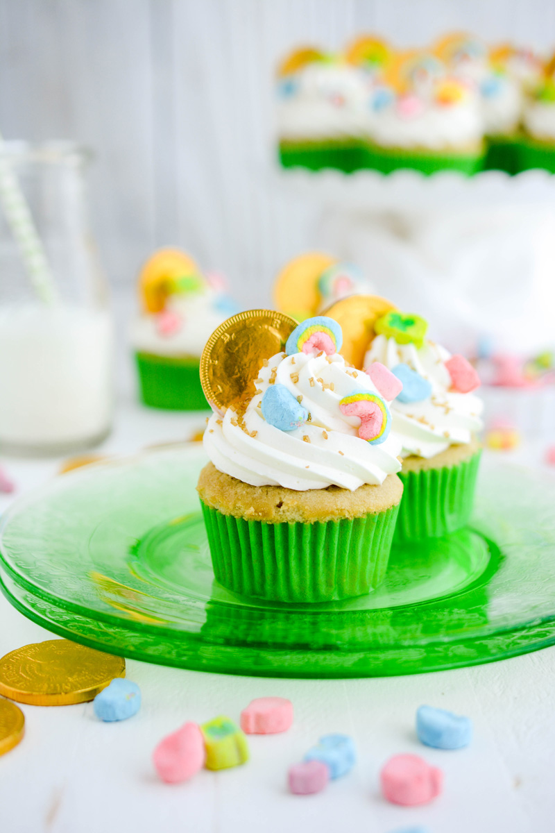Close up of Marshmallow Lucky Charm Cupcakes on green plate.
