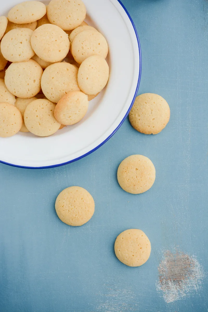 Close up overhead shot of Homemade Vanilla Wafers on a white plate.