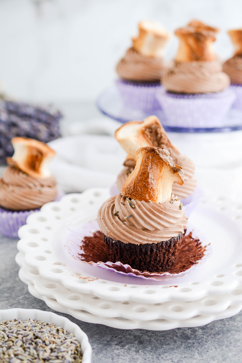 Close up of Hot Chocolate Lavender Cupcake on plate with cupcake liner peeled.