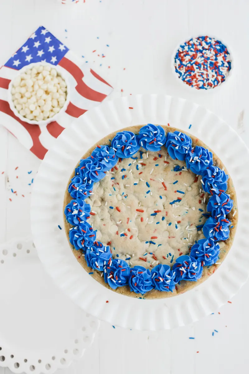 Overhead shot of July 4th Cookie Cake on white cake pedestal.