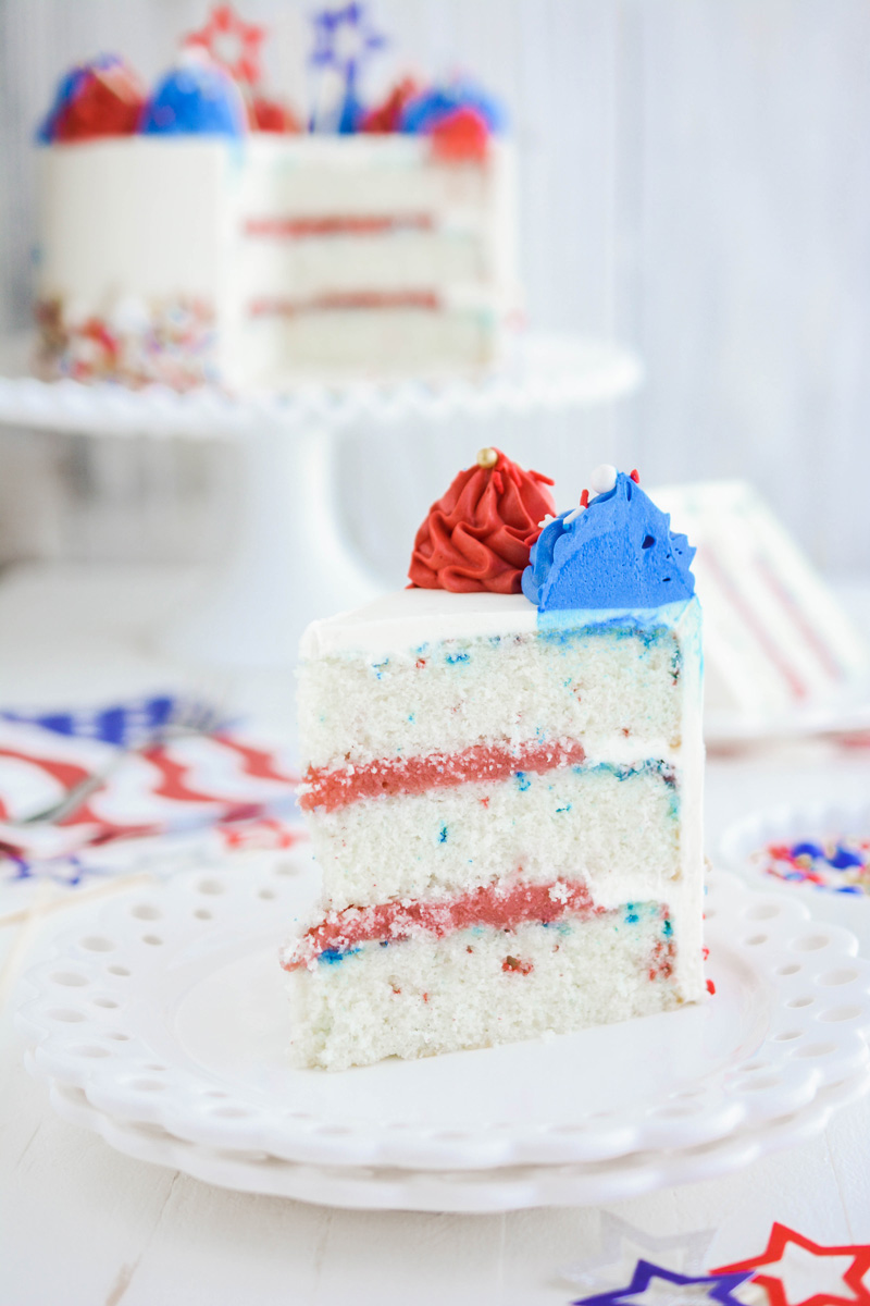 Close up of Patriotic Confetti Cake on white plate.