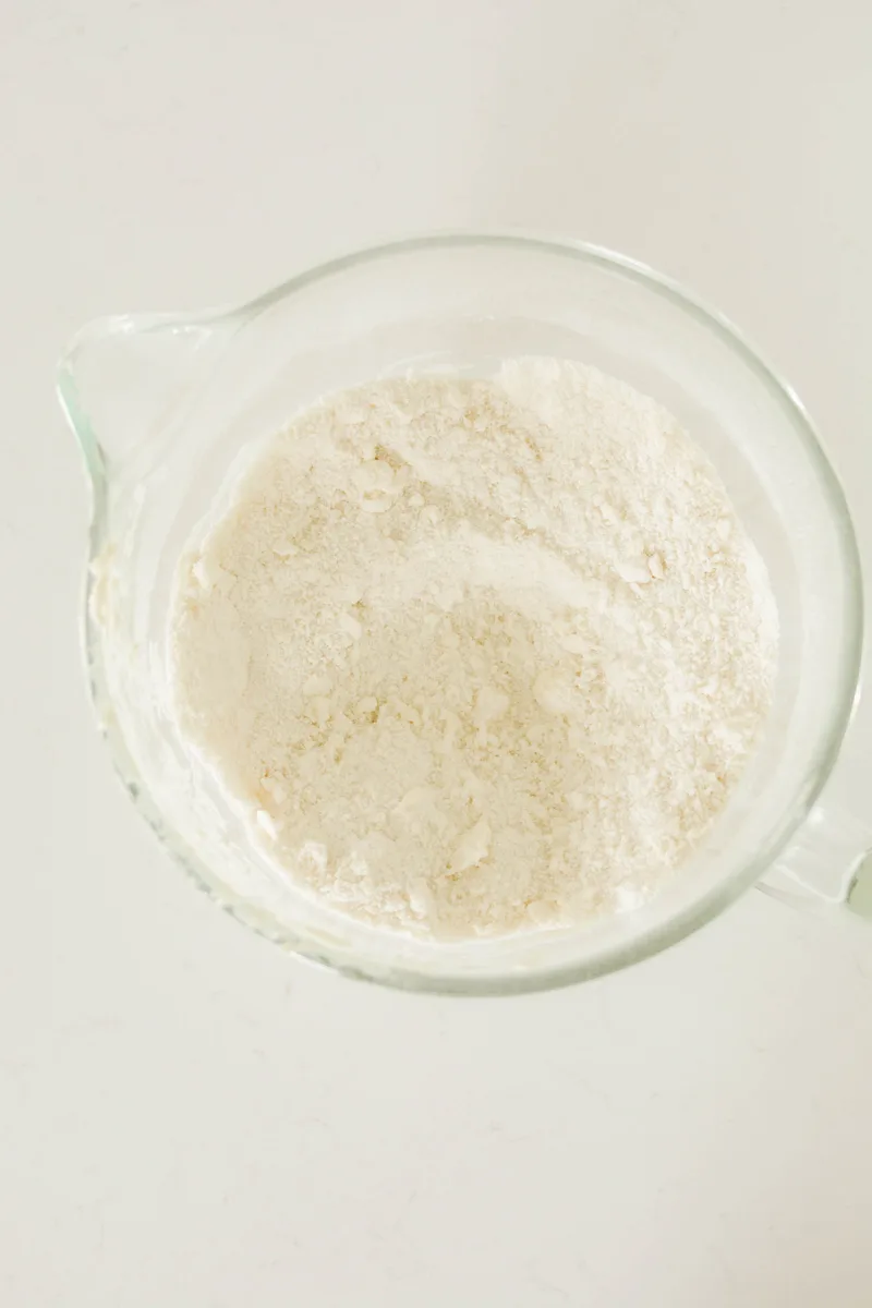 Overhead shot of dry ingredients with butter mixed in for Patriotic Confetti Cake.