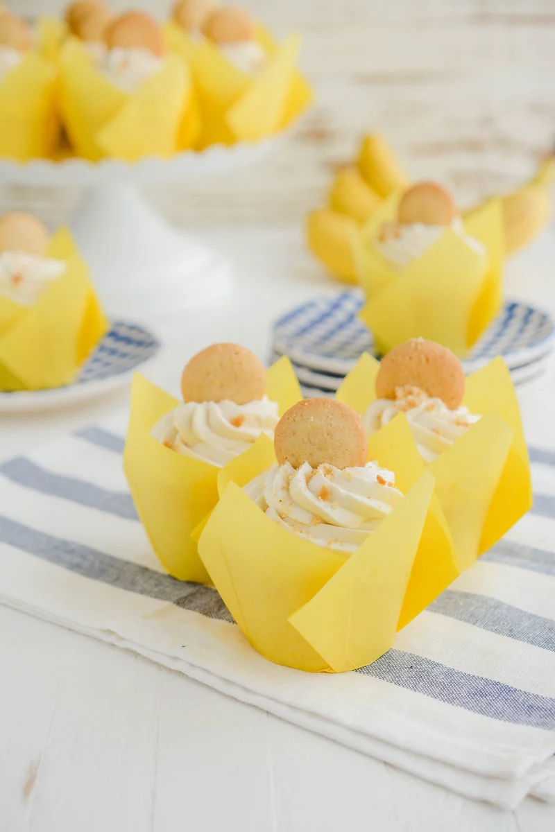 Wide open shot of Banana Cream Pie Cupcakes on towel.