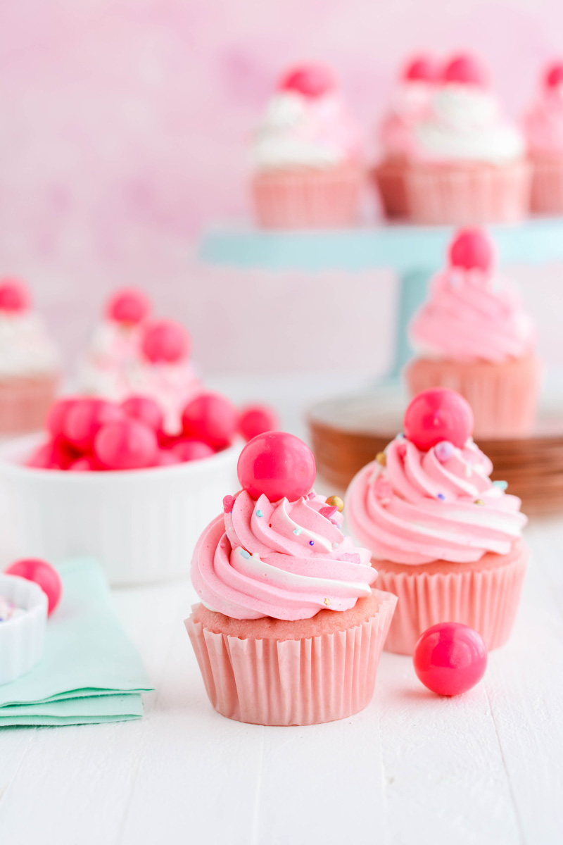 Wide open shot of 2 Pink Bubble Gum Cupcakes.