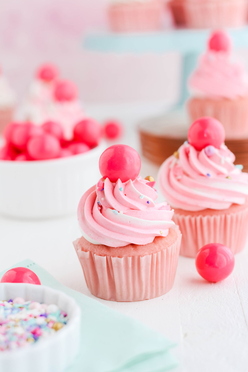 Close up shot of two Pink Bubble Gum Cupcakes.