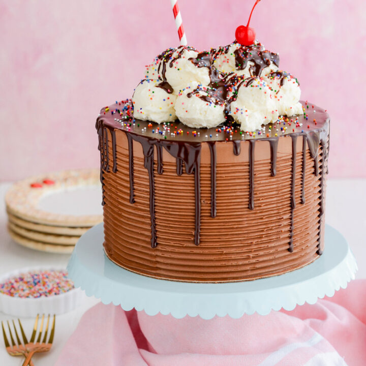 Chocolate Root Beer Float Cake on teal cake pedestal.