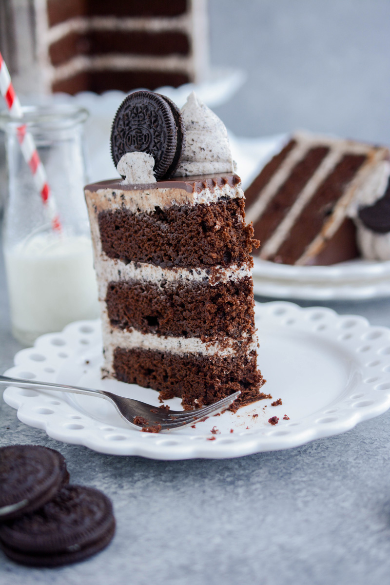 Close up slice of Ultimate Cookies and Cream Layer Cake with fork.