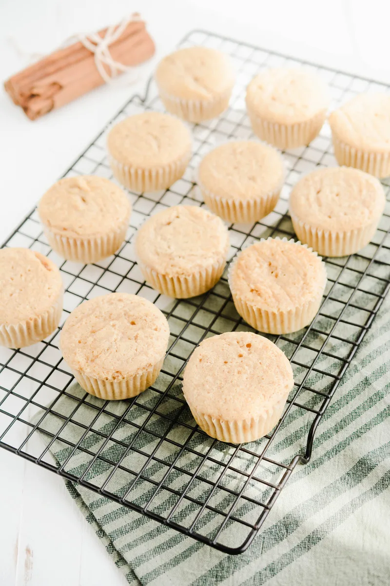 Three quarter angle of cooled Key Lime Pie Cupcakes on cooling rack.